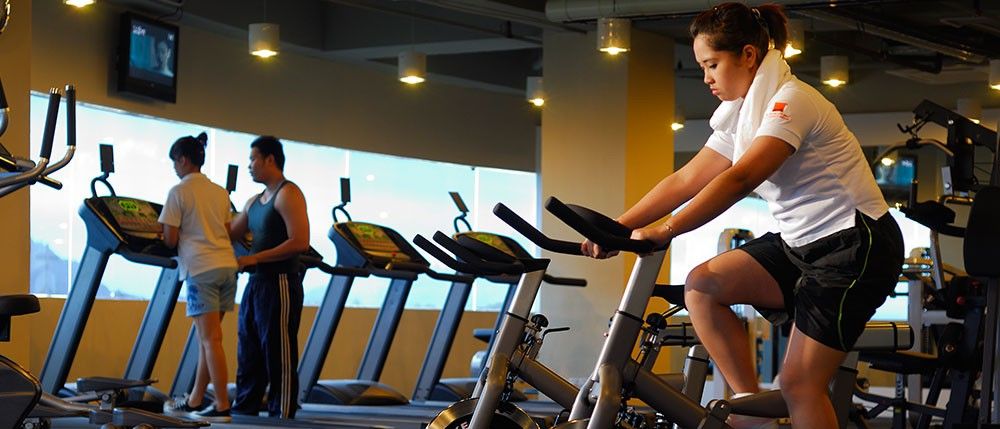 Micasa All Suites Hotel Kuala Lumpur Extérieur photo A woman on a stationary bicycle